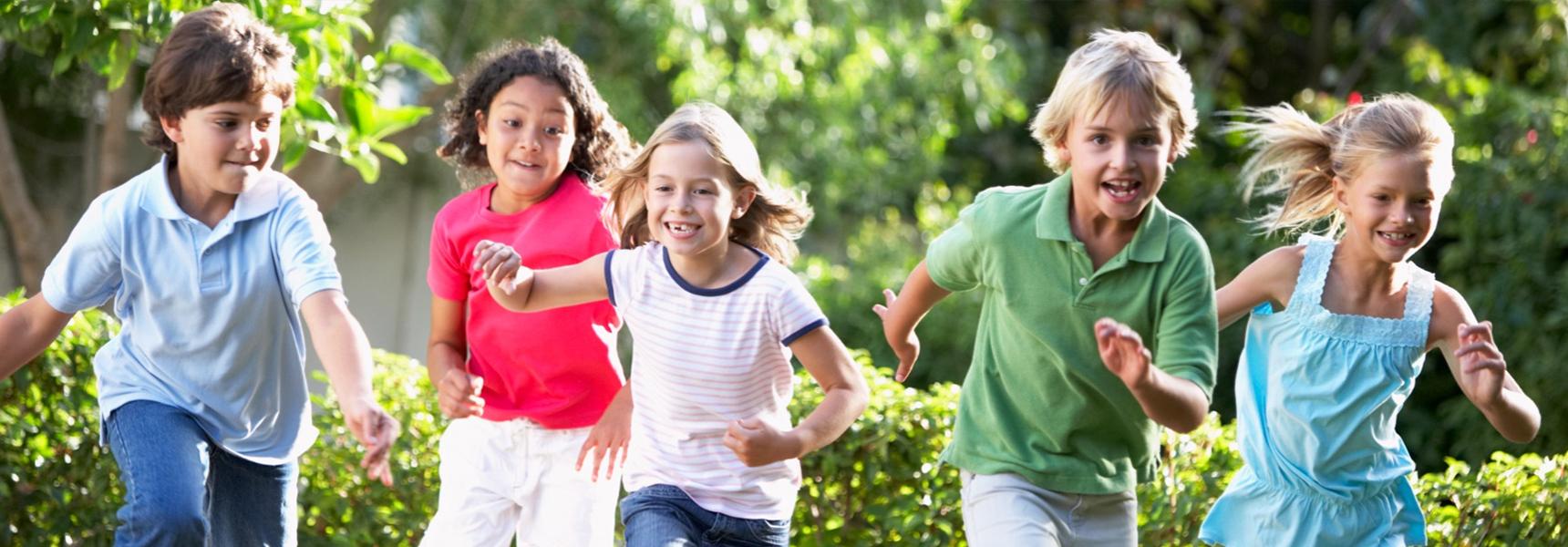 Children running together outdoors
