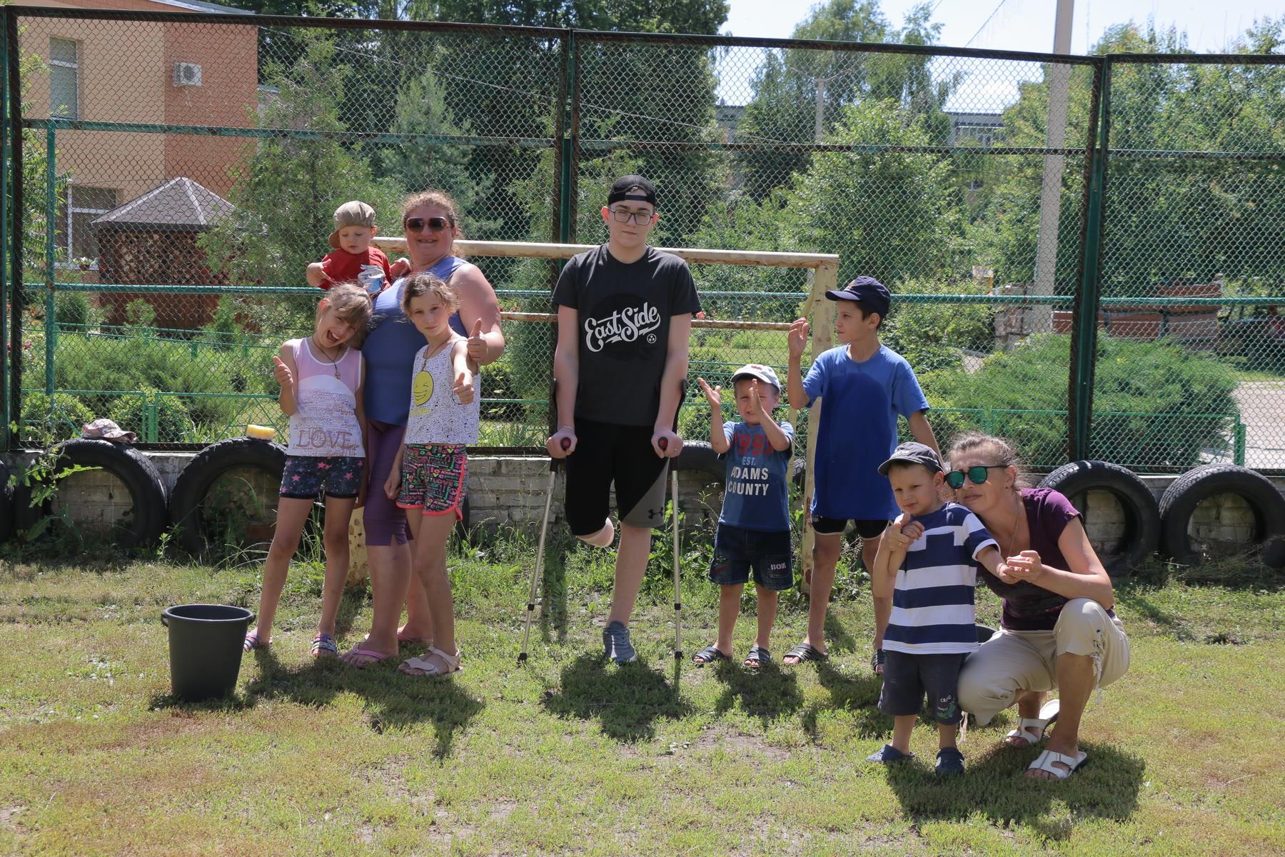 Children and caregivers gathered outdoors