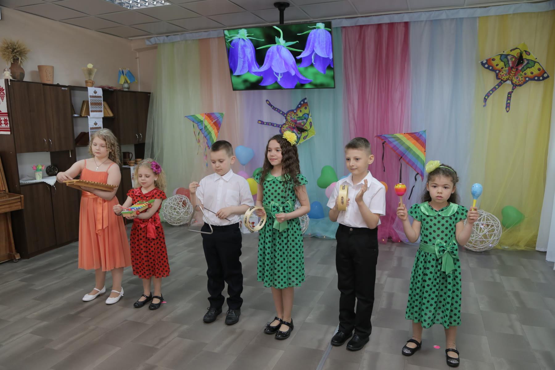 Children performing together during a community activity