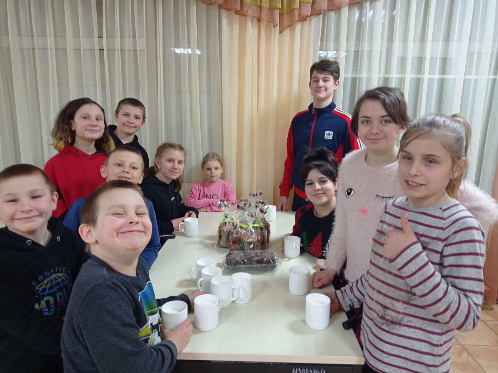 Children sharing holiday treats around a table